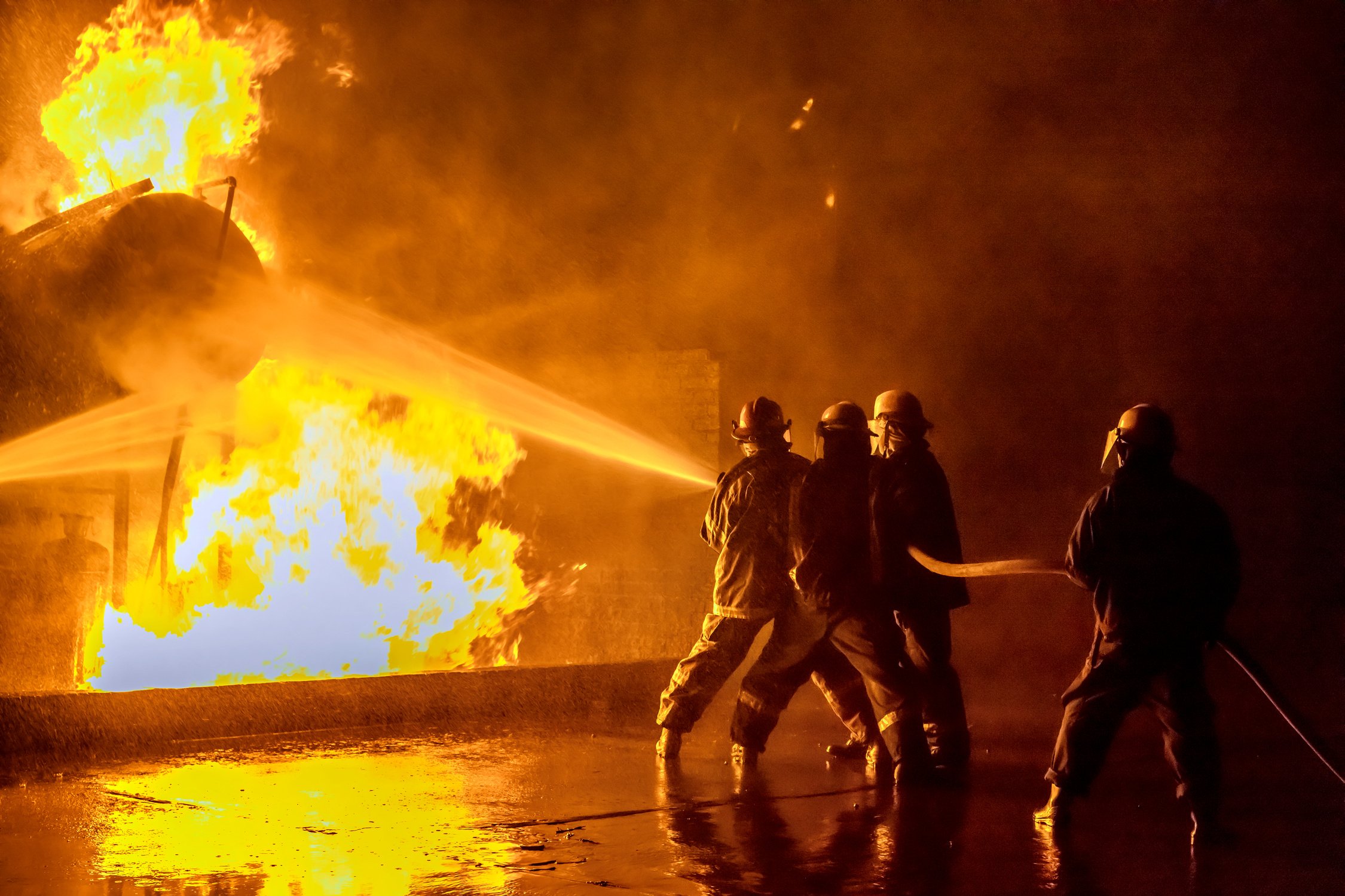 Firefighters extinguishing an industrial fire